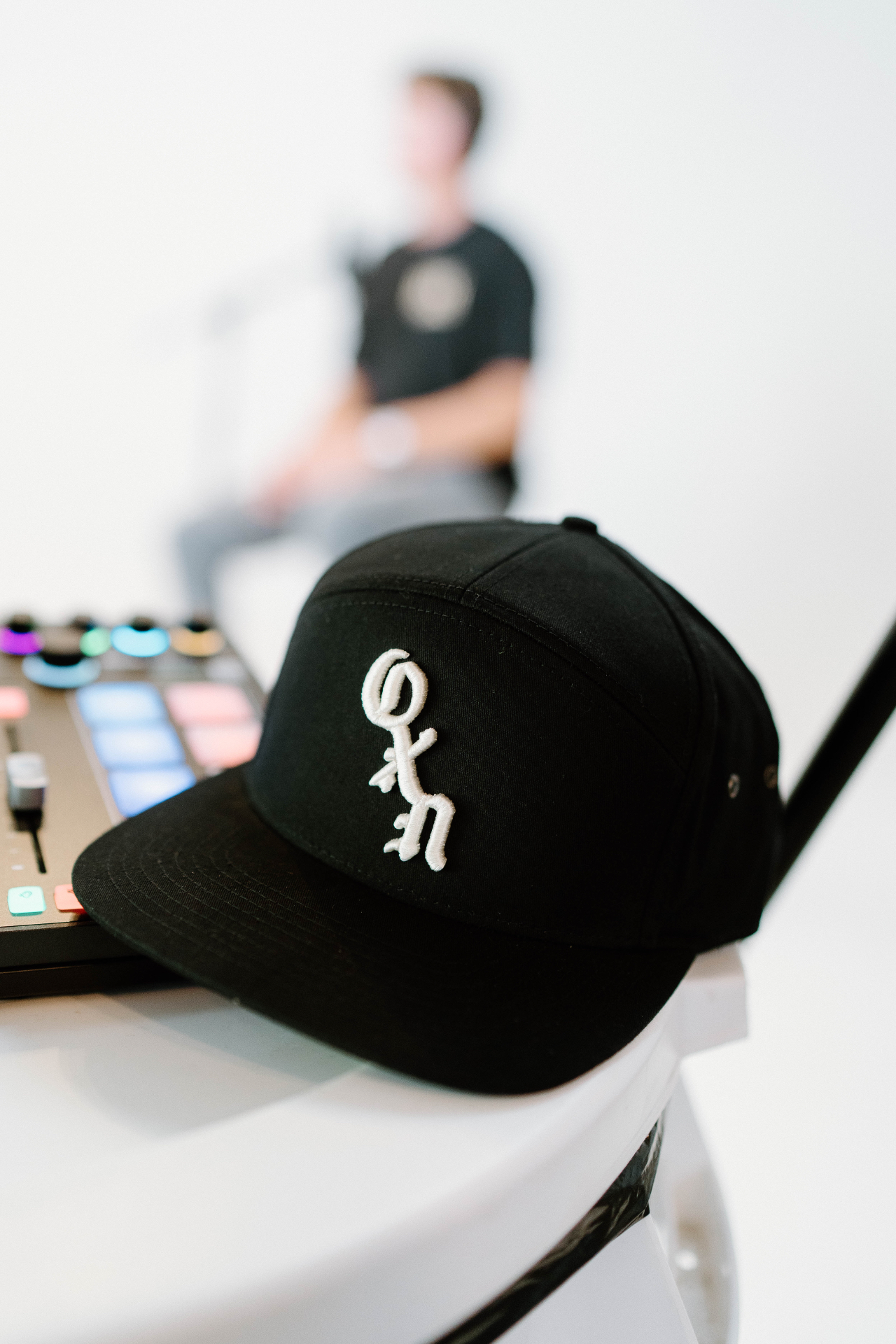 OXN Marketing studio with an OXN cap and production gear